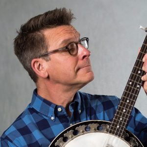 A picture of Jim Gill playing a banjo.