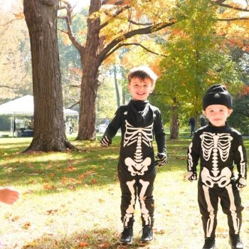 Young children in Halloween costumes play on the grounds during Little Goblins, the not-too-spooky daytime Halloween event for families at Ford House.